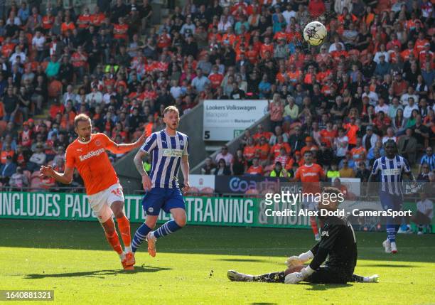 Blackpool's Jordan Rhodes sees a shot saved by Wigan Athletic's Sam Tickle during the Sky Bet League One match between Blackpool and Wigan Athletic...
