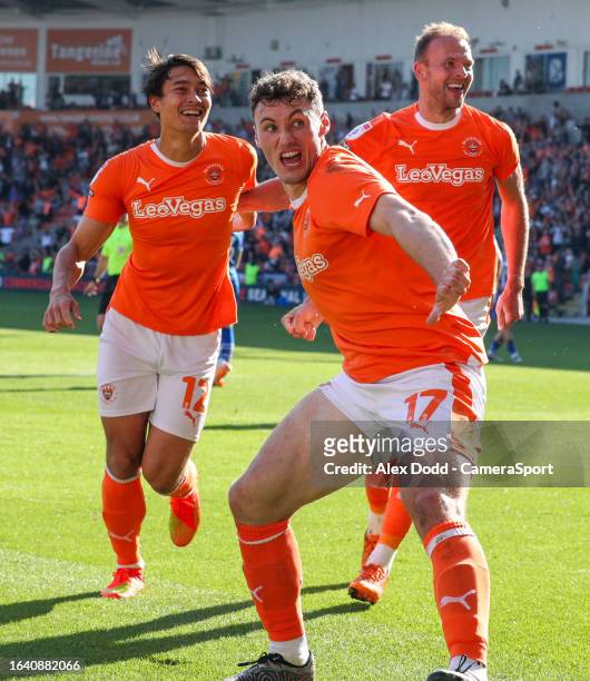 Blackpool's Kenny Dougall celebrates scoring his side's second goal with Matty Virtue and Jordan Rhodes during the Sky Bet League One match between...