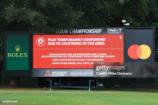 Leaderboard displays a message indicating a suspension of play due to inclement weather during the third round of the TOUR Championship at East Lake...