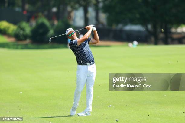 Rickie Fowler of the United States plays a shot on the fifth hole during the third round of the TOUR Championship at East Lake Golf Club on August...