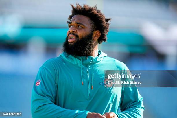 Christian Wilkins of the Miami Dolphins warms up prior to a preseason game against the Jacksonville Jaguars at EverBank Stadium on August 26, 2023 in...