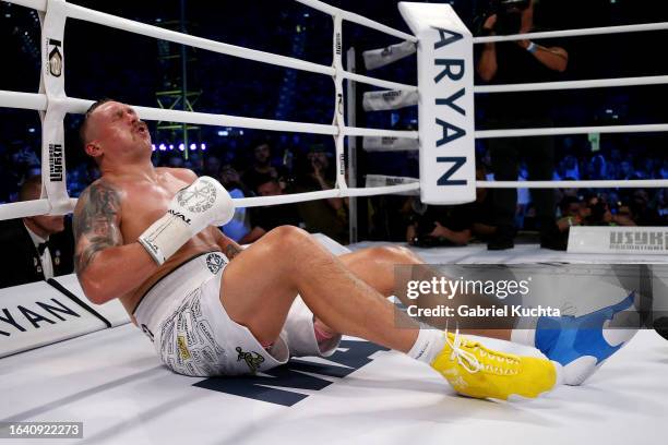 Oleksandr Usyk reacts after being knocked down by Daniel Dubois during the Heavyweight fight between Oleksandr Usyk and Daniel Dubois at Stadion...