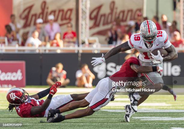 Jamier Johnson of the Indiana Hoosiers makes the tackle on Chip Trayanum of the Ohio State Buckeyes during the second half at Memorial Stadium on...