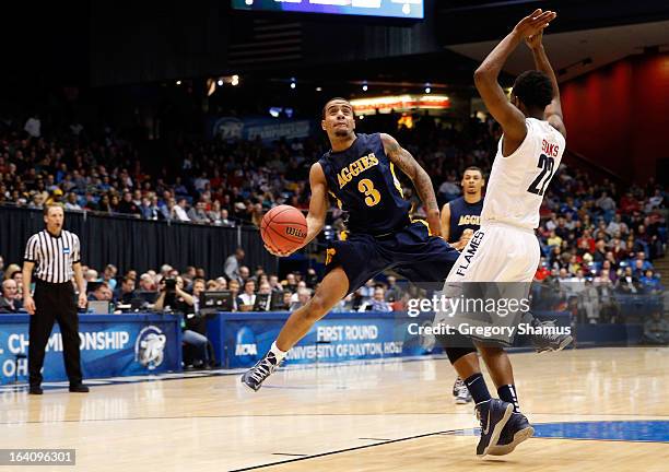 Jeremy Underwood of the North Carolina A&T Aggies drives to the basket in the first half against Tavares Speaks of the Liberty Flames during the...