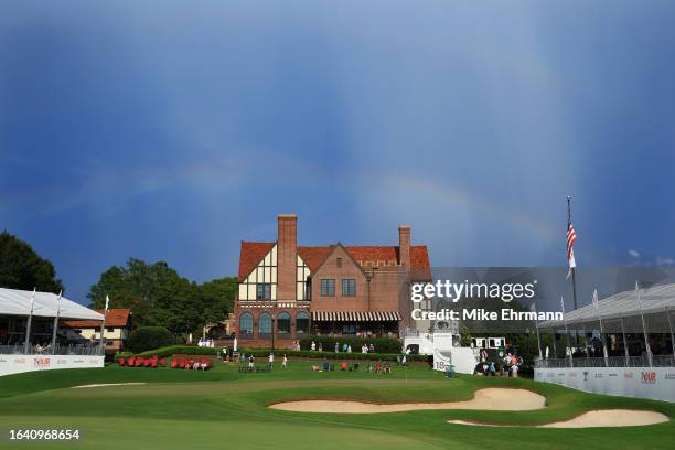 Rainbow is seen over the clubhouse and 18th green during a suspension of play in the third round of the TOUR Championship at East Lake Golf Club on...