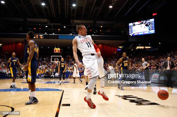 Andrew Smith of the Liberty Flames reacts after he dunked in the second half against the North Carolina A&T Aggies during the first round of the 2013...