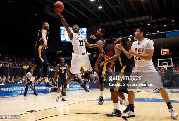 Tavares Speaks of the Liberty Flames drives for a shot attempt against North Carolina A&T Aggies in the second half during the first round of the...