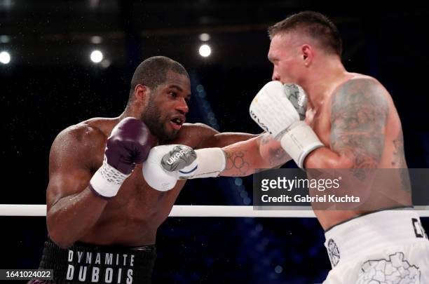 Oleksandr Usyk is punched by Daniel Dubois during the Heavyweight fight between Oleksandr Usyk and Daniel Dubois at Stadion Wroclaw on August 26,...