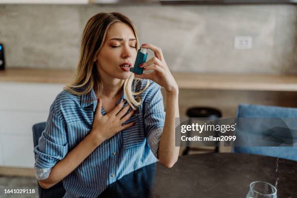 asthma inhaler - asthmatic stock pictures, royalty-free photos & images