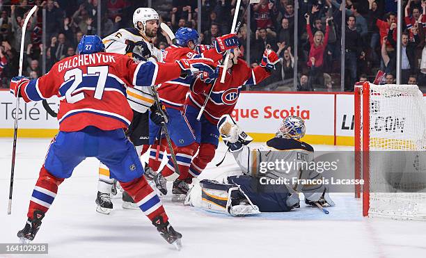 Alex Galchenyuk of the Montreal Canadiens congratulates Colby Armstrong on the tying goal during the NHL game against the Buffalo Sabres on March 19,...