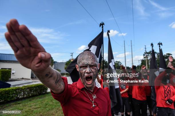 Man does a Nazi salute as two Neo Nazi groups, Blood Tribe and Goyim Defense League, hold a rally on September 2, 2023 in Orlando, Florida. An event...