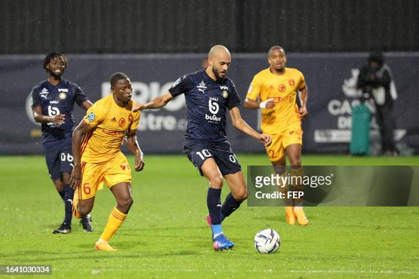 Ahmad NGOUYAMSA - 10 Khalid BOUTAIB during the Ligue 2 BKT match between Pau Football Club and Rodez Aveyron Football at Nouste Camp on August 2,...