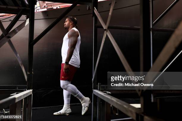 Jonathan Allen of the Washington Commanders walks through the tunnel to the field prior to an NFL preseason game against the Cincinnati Bengals at...