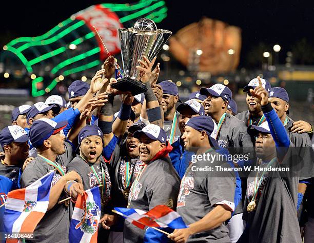 The Dominican Republic celerbates with the trophy after defeating Puerto Rico to win the Championship Round of the 2013 World Baseball Classic by a...