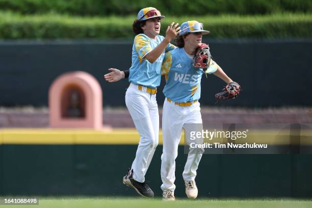 Ollie Parks and Max Baker of the West Region team from El Segundo, California react during the first inning against the Southwest Region team from...