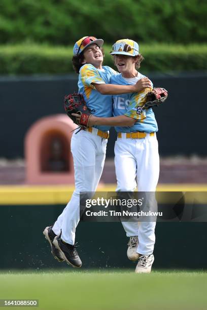 Ollie Parks and Max Baker of the West Region team from El Segundo, California react during the first inning against the Southwest Region team from...