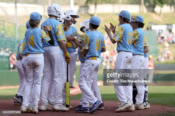 The of the West Region team from El Segundo, California celebrate a home run hit by Louis Lappe during the fifth inning against the Southwest Region...