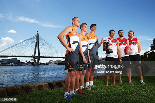 Tom Scully, Lachie Whitfield and Jonathon Patton of the Giants and Josh Kennedy, Heath Grundy and Lewis Roberts-Thomson of the Swans pose during a...