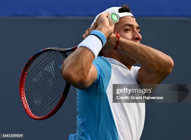 Sebastian Baez of Argentina returns a shot to Jiri Lehecka of the Czech Republic during the men's final of the Winston-Salem Open at Wake Forest...