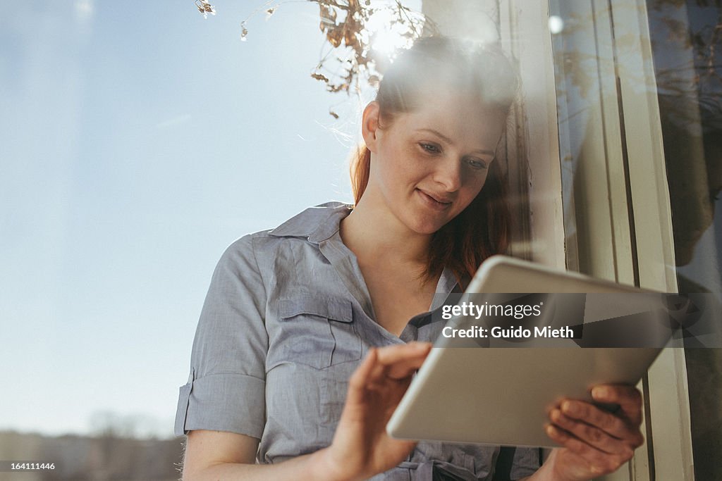 Woman using tablet pc.