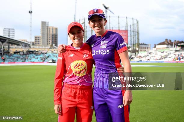 Alex Hartley of Welsh Fire poses for a photograph with Kate Cross of Northern Superchargers after the match is abandoned following a Storm and...