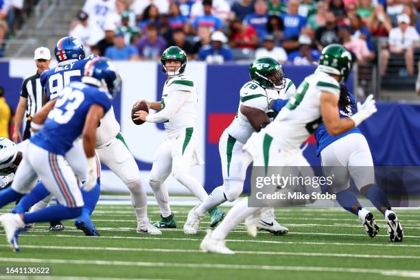 Zach Wilson of the New York Jets passes the ball against the New York Giants during a preseason game at MetLife Stadium on August 26, 2023 in East...