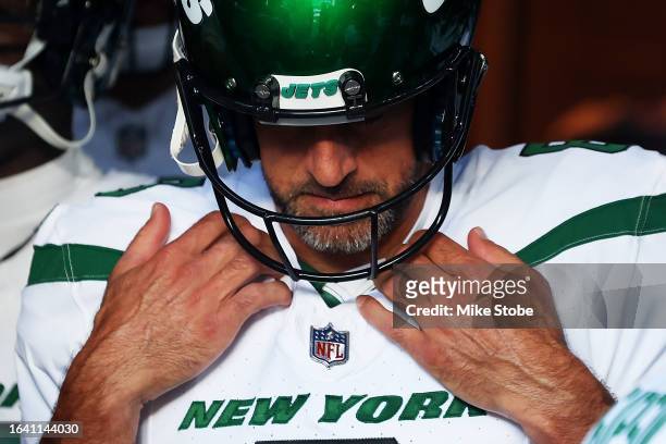 Aaron Rodgers of the New York Jets waits in the tunnel prior to a preseason game against the New York Giants at MetLife Stadium on August 26, 2023 in...