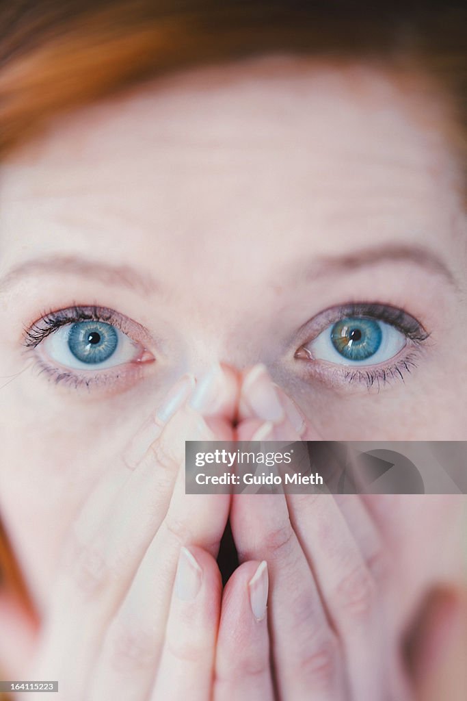 Close up of a scared woman face.