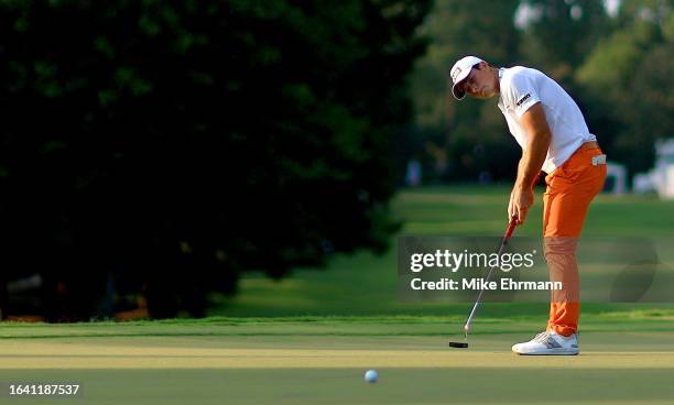 Viktor Hovland of Norway putts on the 13th green during the third round of the TOUR Championship at East Lake Golf Club on August 26, 2023 in...