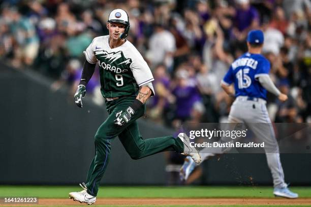 Brenton Doyle of the Colorado Rockies runs after hitting a bases-loaded triple scoring three runs against the Toronto Blue Jays in the fifth inning...