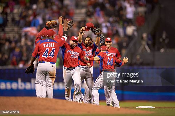 World Baseball Classic: Team Puerto Rico Angel Pagan 16) and teammates victorious on field after winning Semifinals game vs Team Japan at AT&T Park....