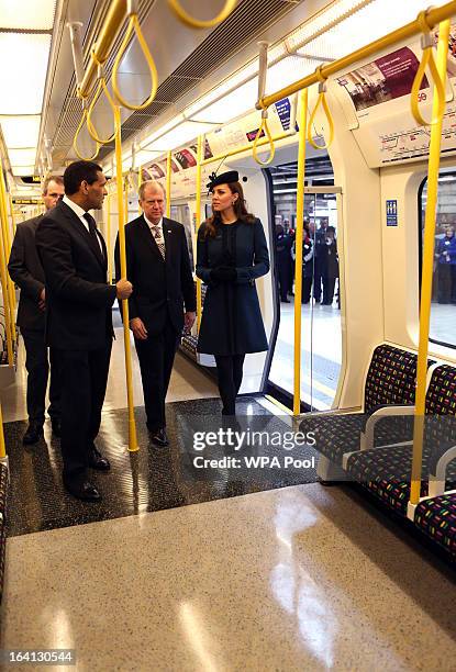 Catherine, Duchess of Cambridge stands onboard a train as she makes an official visit to Baker Street Underground Station, to mark 150th anniversary...