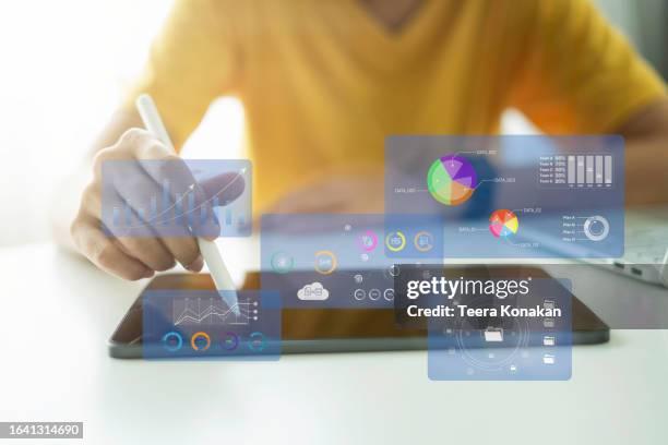 collaborative corporate finance analysis businesspeople strategizing on monitor graph dashboard - digitales marketing stock-fotos und bilder