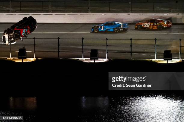 Ryan Preece, driver of the RaceChoice.com Ford, flips after an on-track incident during the NASCAR Cup Series Coke Zero Sugar 400 at Daytona...