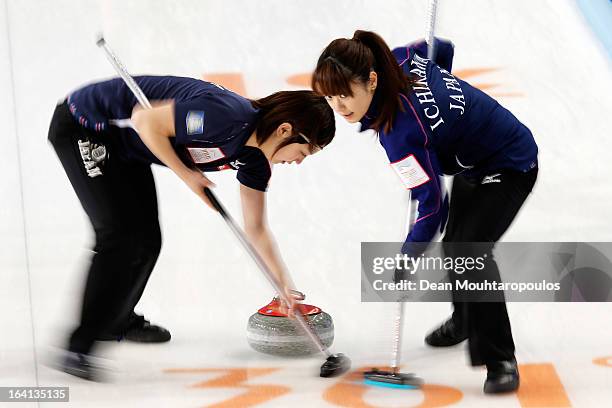 Miyo Ichikawa and Chiaki Matsumura of Japan sweep in the match between Japan and Russia on Day 5 of the Titlis Glacier Mountain World Women's Curling...