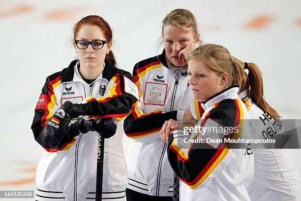 Andrea Schopp, Corinna Scholz, Stella Heiss and Imogen Oona Lehmann of Germany wait for a decision in the match between Switzerland and Germany on...