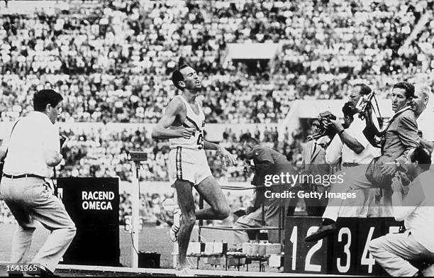 Herb Elliott of Australia finishes the 1500 meters final at the 1960 Olympic Games in Rome in a world record time of 3 minutes 35.6 seconds.Italy. \...