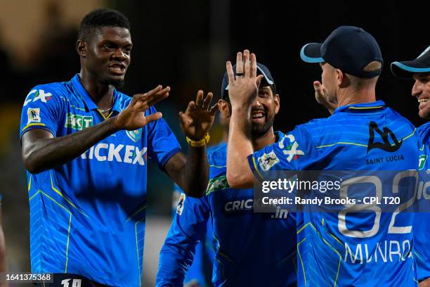 Alzarri Joseph and Colin Munro of Saint Lucia Kings celebrate the dismissal of Rahkeem Cornwall of Barbados Royals during the Men's 2023 Republic...