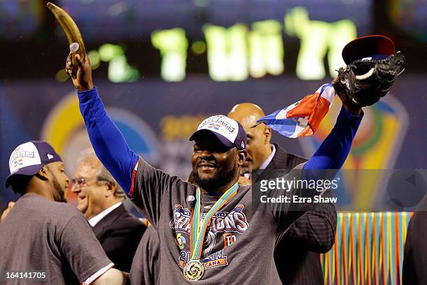 Fernando Rodney of the Dominican Republic holds a plantain as he celebrates after defeating Puerto Rico to win the Championship Round of the 2013...