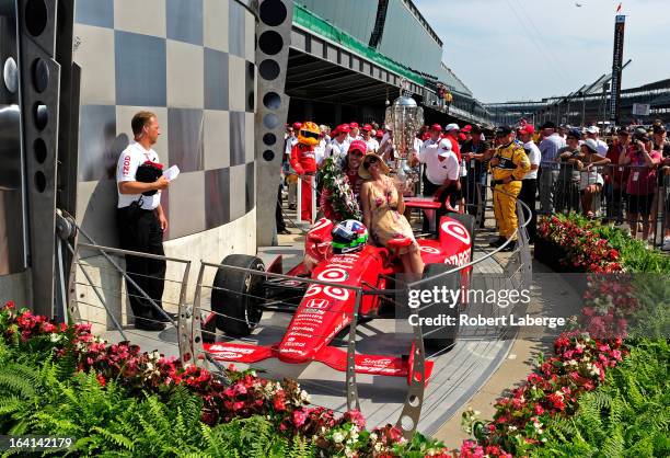 Dario Franchitti of Scotland, driver of the Target Chip Ganassi Racing Honda celebrates with his wife Ashley Judd in victory lane after Franchitti...