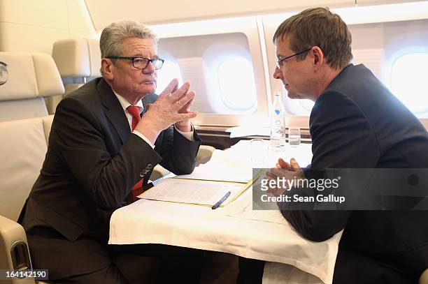 German President Joachim Gauck talks with State Secretary and head of the Federal Presidential Office David Gill on their return from a state visit...
