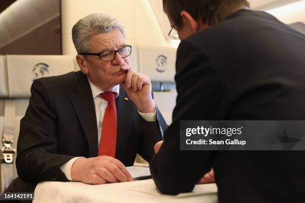 German President Joachim Gauck talks with State Secretary and head of the Federal Presidential Office David Gill on their return from a state visit...