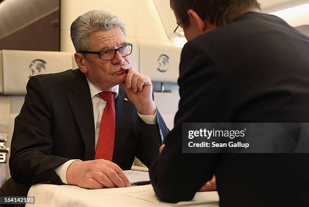 German President Joachim Gauck talks with State Secretary and head of the Federal Presidential Office David Gill on their return from a state visit...