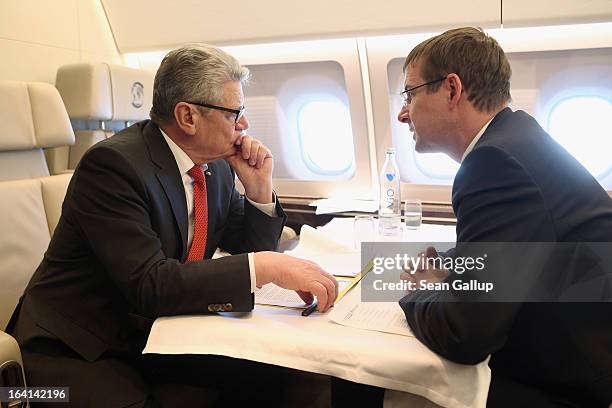 German President Joachim Gauck talks with State Secretary and head of the Federal Presidential Office David Gill on their return from a state visit...