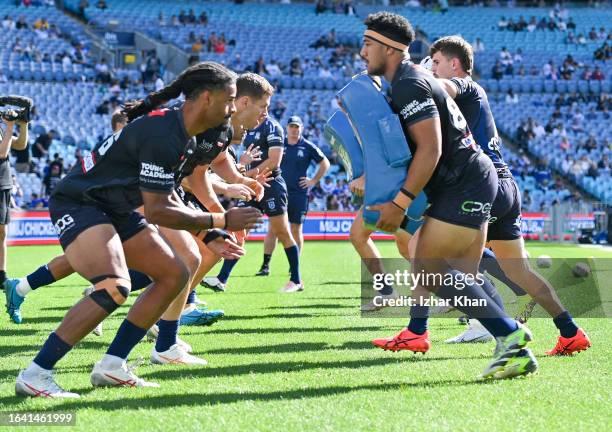 Bulldogs players warms up prior to the round 26 NRL match between Canterbury Bulldogs and Manly Sea Eagles at Accor Stadium on August 27, 2023 in...