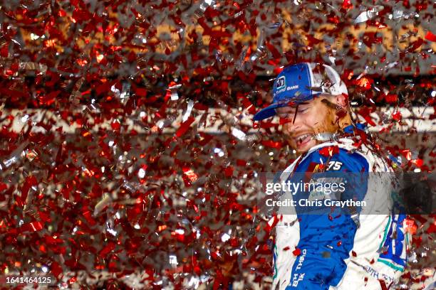 Chris Buescher, driver of the Fifth Third Bank Ford, celebrates in victory lane after winning the NASCAR Cup Series Coke Zero Sugar 400 at Daytona...