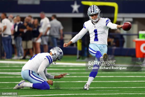 Brandon Aubrey of the Dallas Cowboys takes practice kicks before a preseason game against the Las Vegas Raiders at AT&T Stadium on August 26, 2023 in...