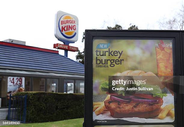 Sign advertising the new Burger King turkey burger is displayed at the drive thru of a Burger King restaurant on March 20, 2013 in Oakland,...