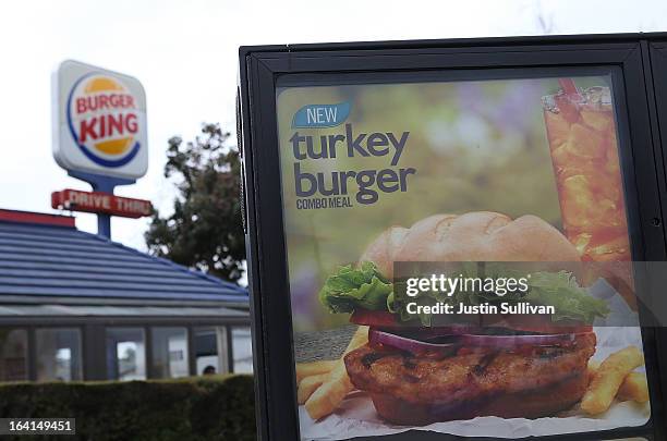 Sign advertising the new Burger King turkey burger is displayed at the drive thru of a Burger King restaurant on March 20, 2013 in Oakland,...