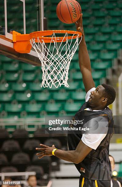 Wichita State Shockers center Ehimen Orukpe dunks during practice at Energy Solutions Arena in Salt Lake City, Utah, Wednesday, March 20, 2013. WSU...